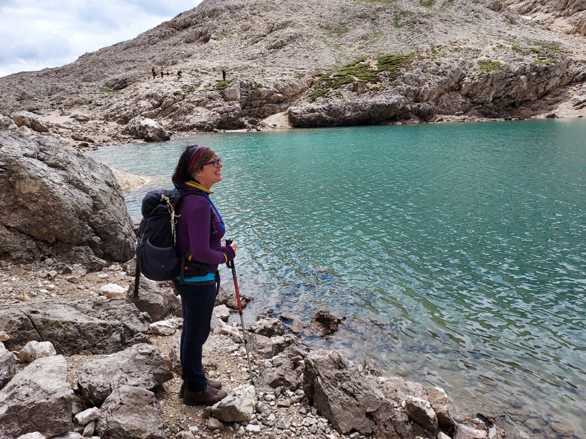 Dr Susanne Etti stood on the rocks by the side of a glistening aquamarine lake.